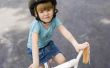 Hoe om een kind te rijden op een driewieler te leren