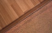 Hoe de overgang van de laminaat vloer naar tapijt