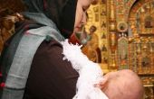 Het verwijderen van vlekken in de kleren van de doop van de Baby