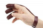 Het gebruik van tabbladen van de vinger, handschoenen en geluiddempers op een boog
