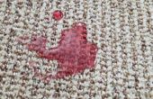 Hoe krijg ik een rode Punch vlek uit tapijt