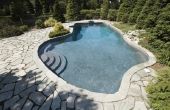 Welke Is beter voor rond een zwembad: klinkers of beton?