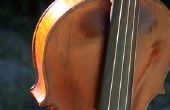 Toepassen van hars op de strijkstok van de viool