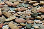 Hoe te poetsen rivier rotsen