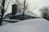 Wat kan ik bouwen om te verhinderen dat sneeuw glijden langs de kant van mijn huis?
