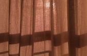 Hoe Hang gordijnen wanneer het venster voldoet aan de muur